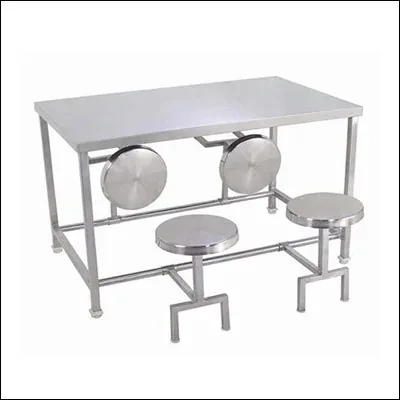 Stainless steel dining table with four attached fold-out stools on a tubular frame - commercial canteen and cafeteria seating