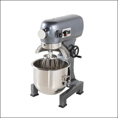 Commercial planetary food mixer with stainless steel bowl, whisk attachment and safety guard on a heavy floor stand - bakery dough and batter mixer