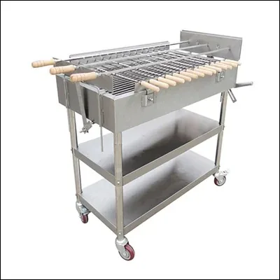 Stainless steel charcoal barbecue grill trolley with rotating skewers, wooden handles and two undershelves on castors - commercial mobile BBQ