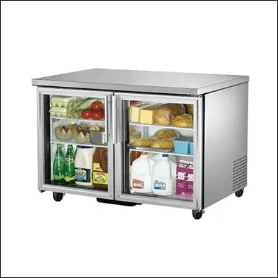 Stainless steel undercounter refrigerator with two glass doors stocked with food and drinks - commercial undercounter chiller