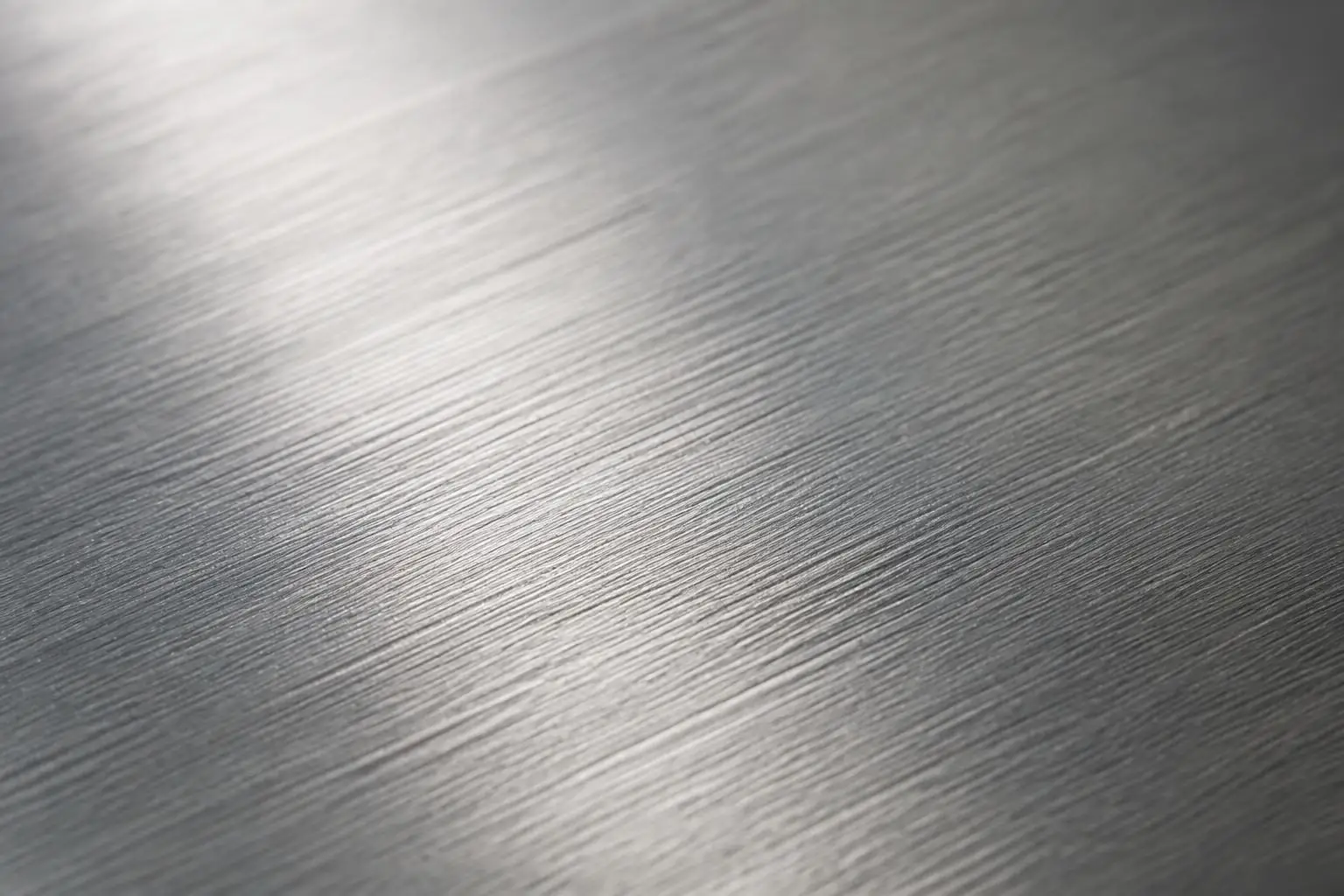 Close-up of a brushed grade 304 stainless steel sheet surface